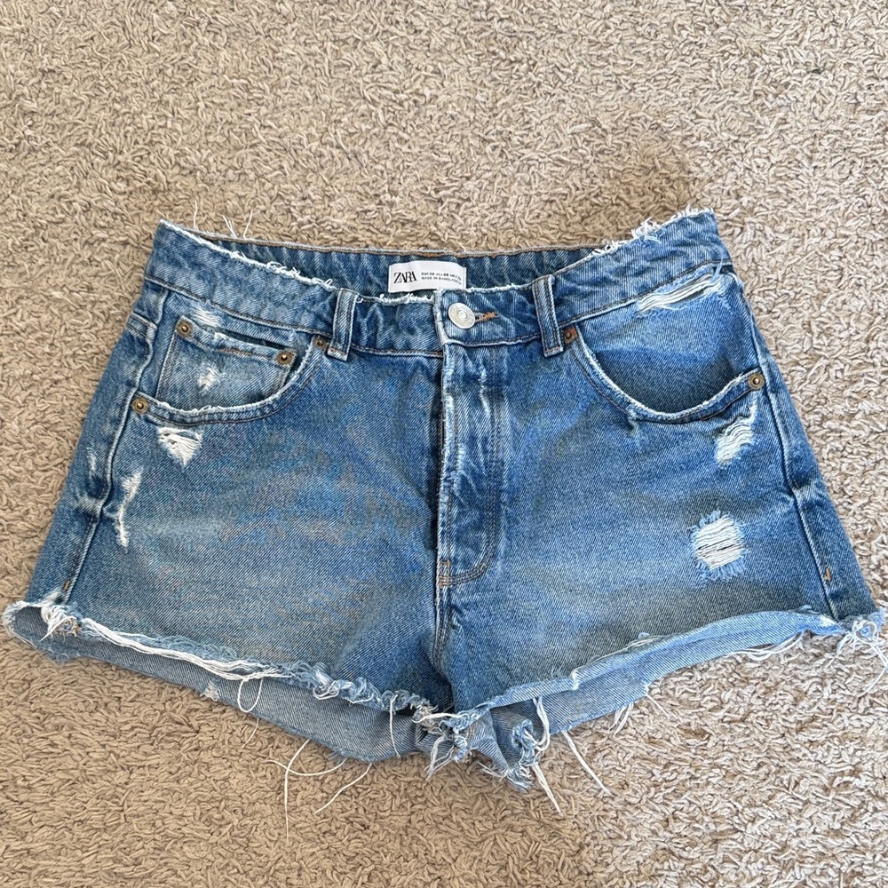 18. | Zara | Light Blue Ripped Denim Cutoff Shorts